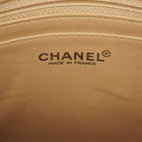 Bolso de Hombro Chanel Straight Flap en Piel de Cordero Beige con Pátina Vintage
